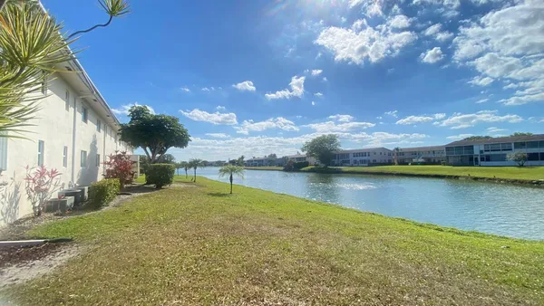a view of a lake with a house in the background