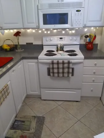 a kitchen with a stove and a cabinets