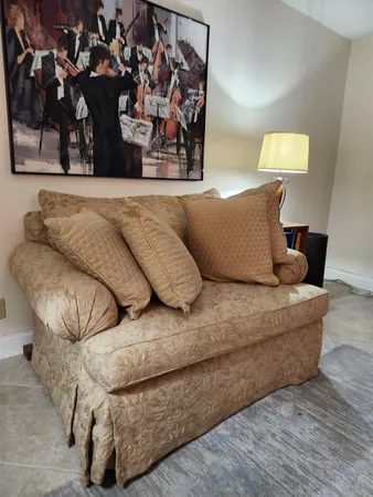 a living room with furniture and a lamp