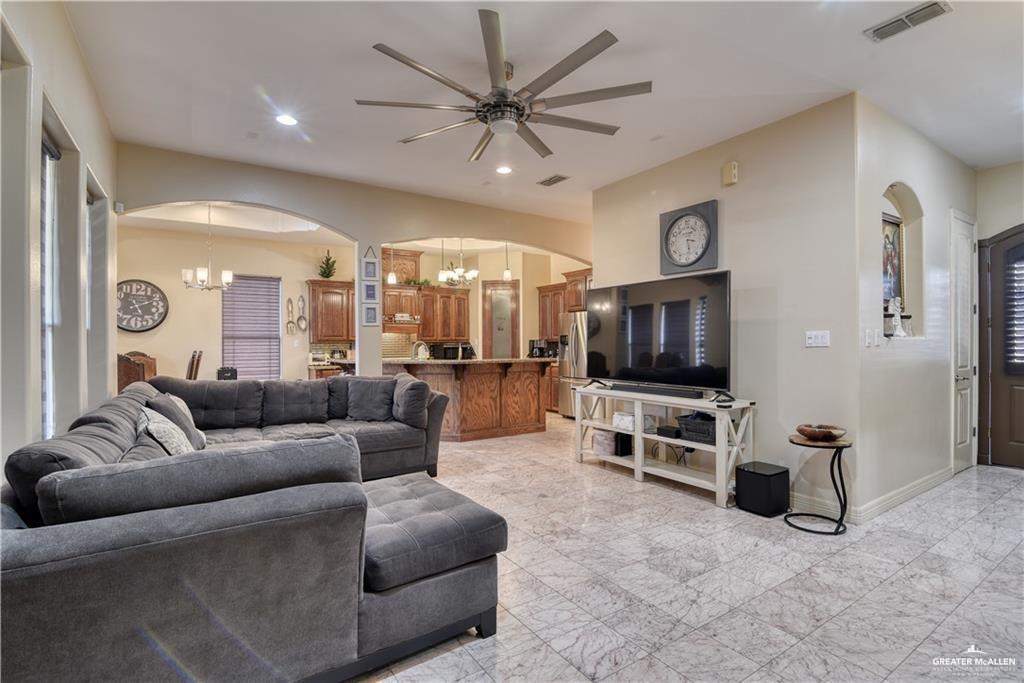 2016 South 48th Street McAllen, TX 78503 - Photo 3 of 9 a living room with furniture and a flat screen tv