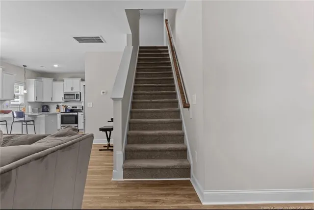 a view of an entryway with wooden floor