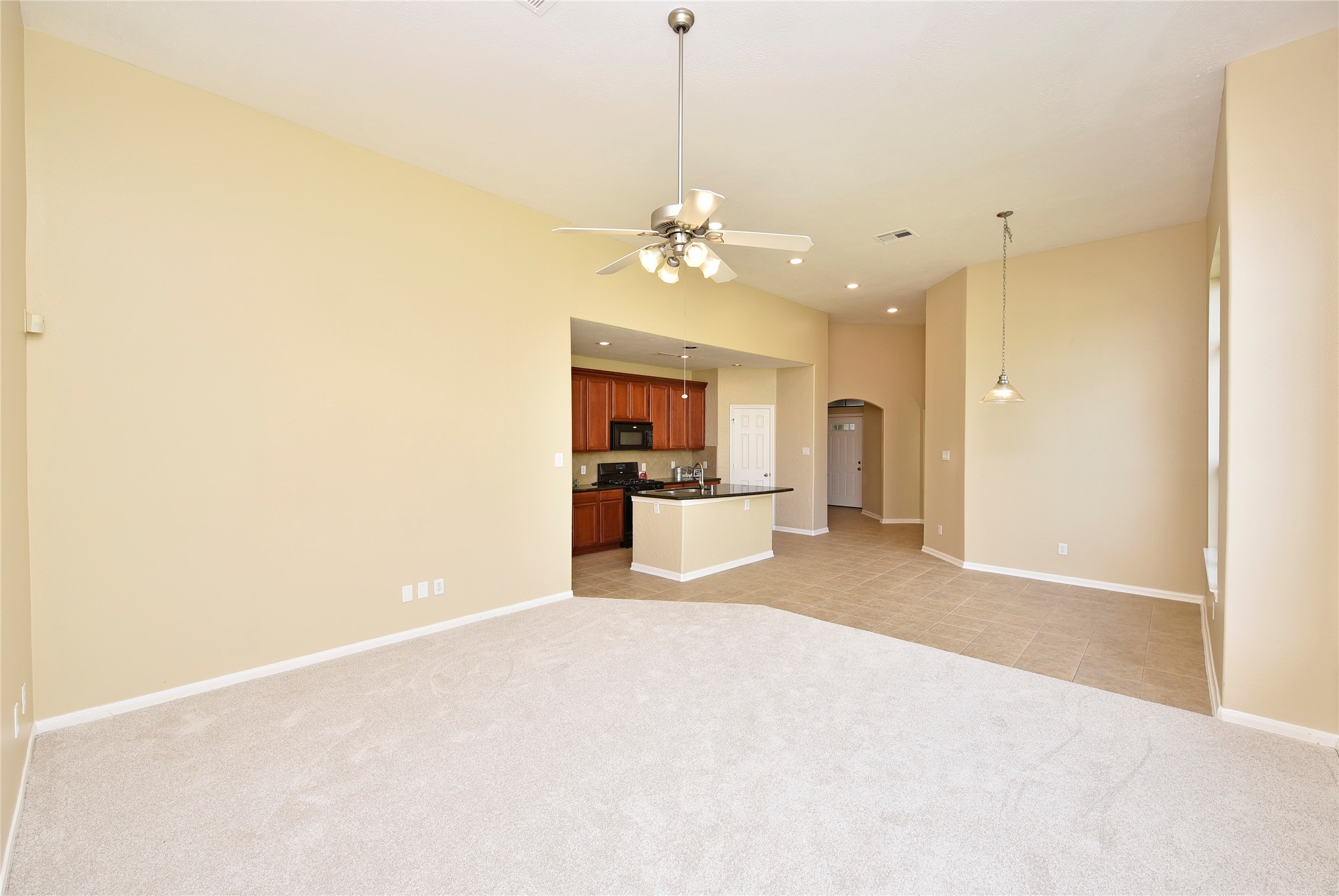 29703 Meridian Hill Drive Spring, TX 77386 - Photo 11 of 43 a view of a kitchen with a sink and a refrigerator