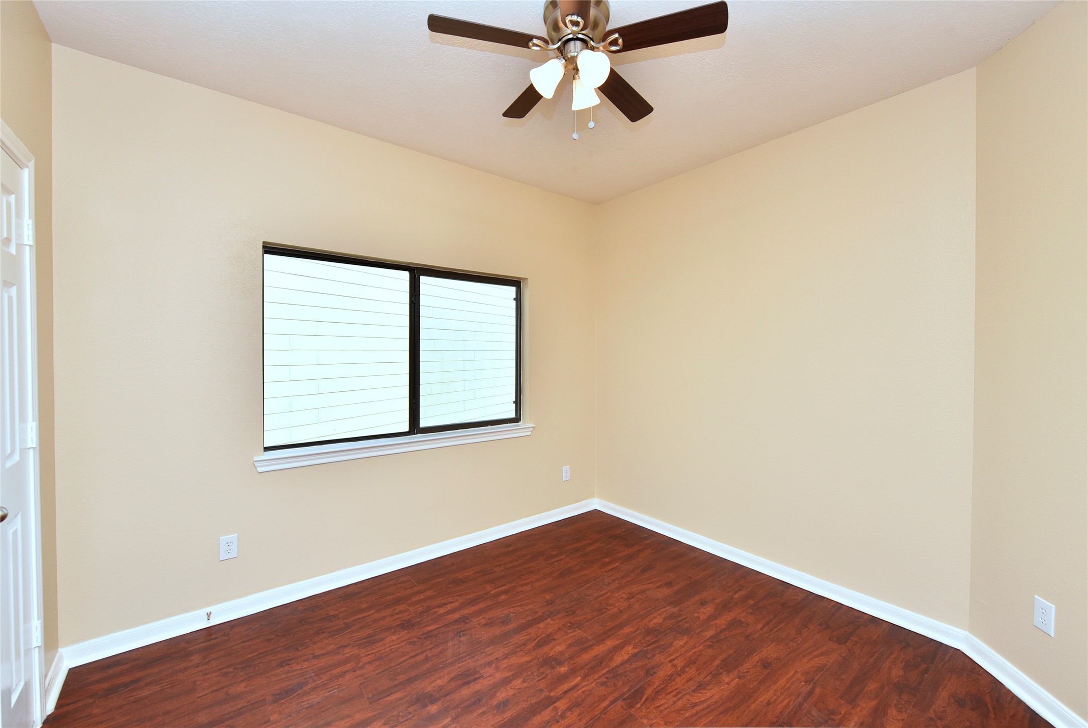 29703 Meridian Hill Drive Spring, TX 77386 - Photo 21 of 43 an empty room with wooden floor fan and windows