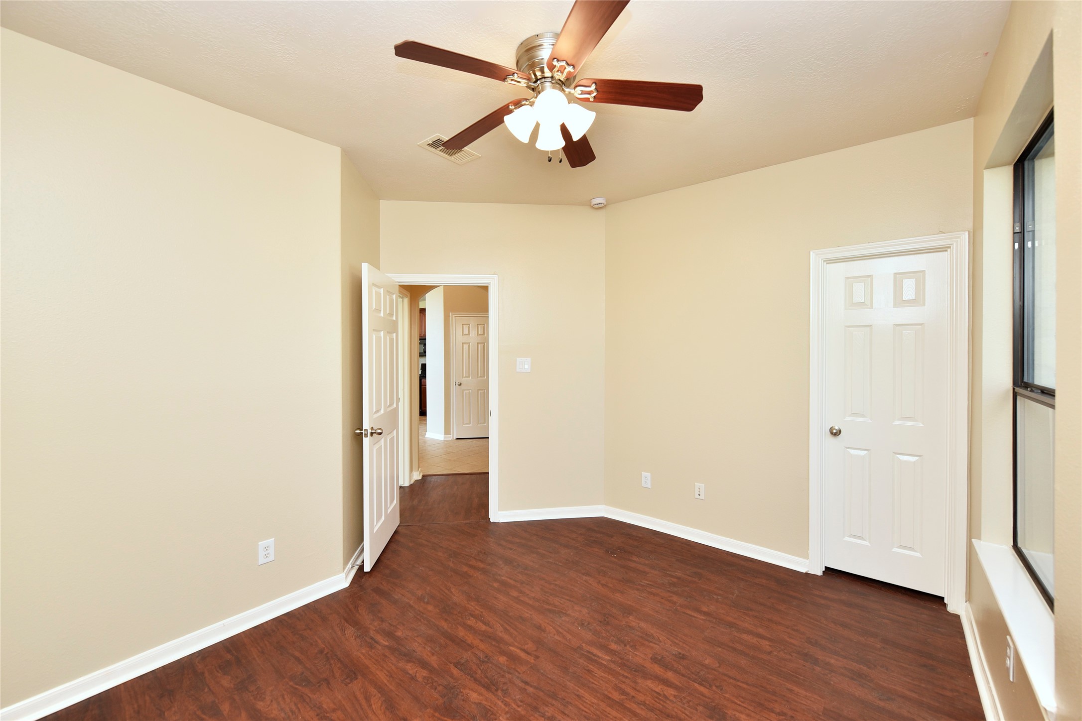 29703 Meridian Hill Drive Spring, TX 77386 - Photo 24 of 43 an empty room with wooden floor and a ceiling fan