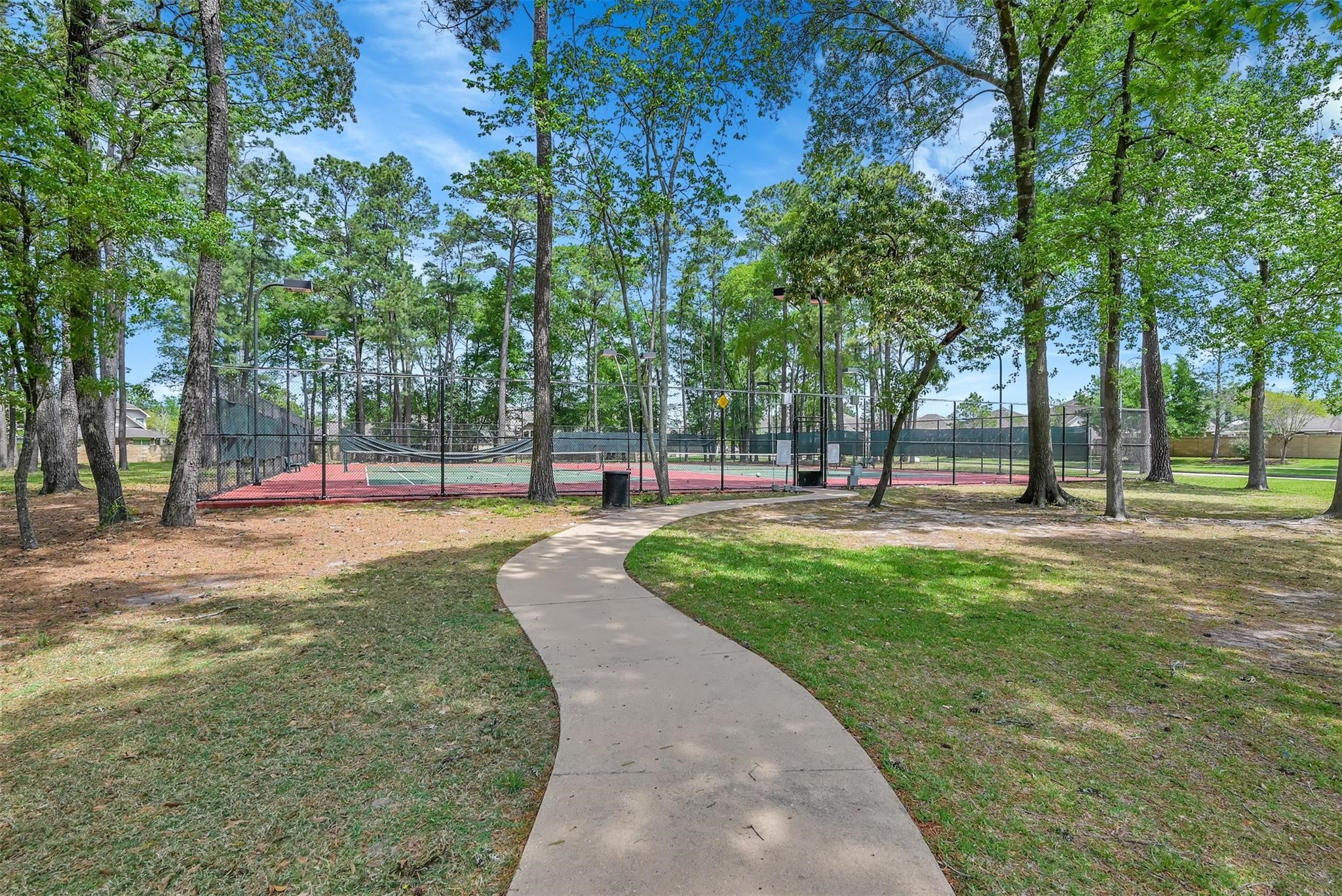 29703 Meridian Hill Drive Spring, TX 77386 - Photo 41 of 43 a building with trees in the background