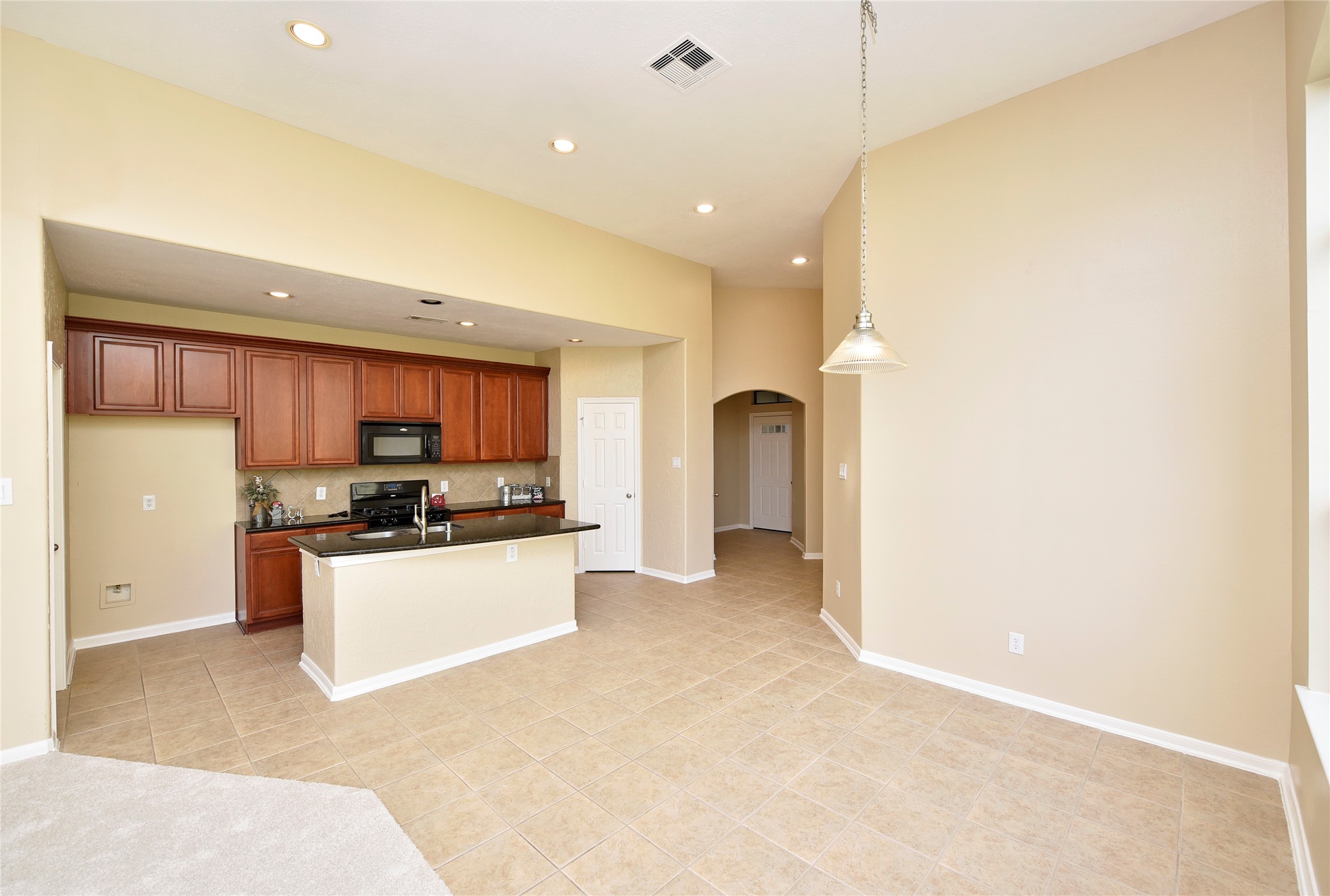 29703 Meridian Hill Drive Spring, TX 77386 - Photo 9 of 43 a kitchen with stainless steel appliances a refrigerator and a stove