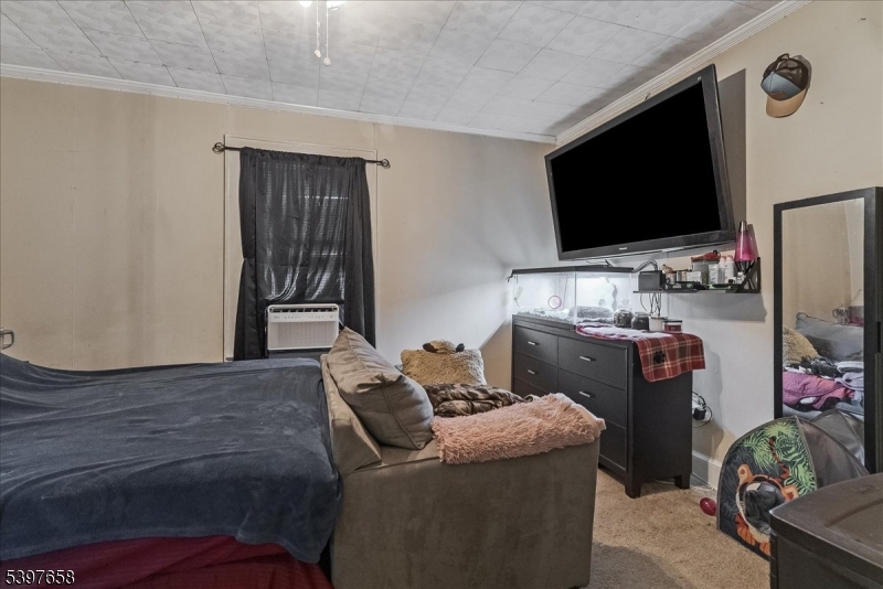 104 Ridgedale Avenue Cedar Knolls, NJ 07927 - Photo 12 of 47 a living room with furniture and a flat screen tv