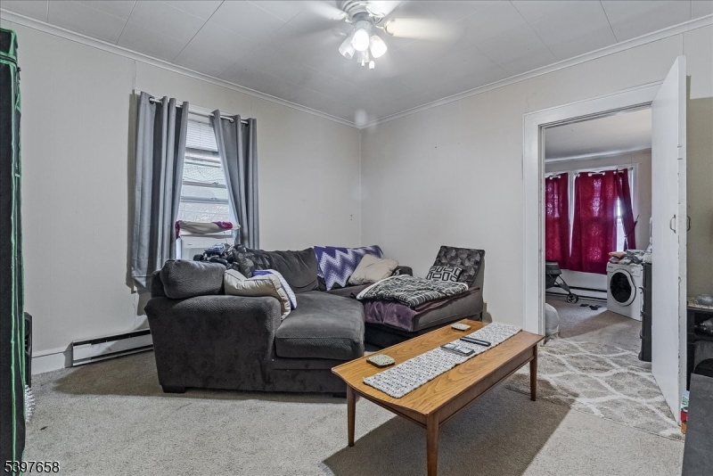 104 Ridgedale Avenue Cedar Knolls, NJ 07927 - Photo 13 of 47 a living room with furniture and a window