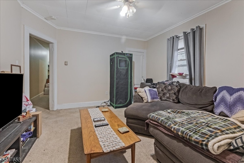 104 Ridgedale Avenue Cedar Knolls, NJ 07927 - Photo 14 of 47 a living room with furniture and a flat screen tv