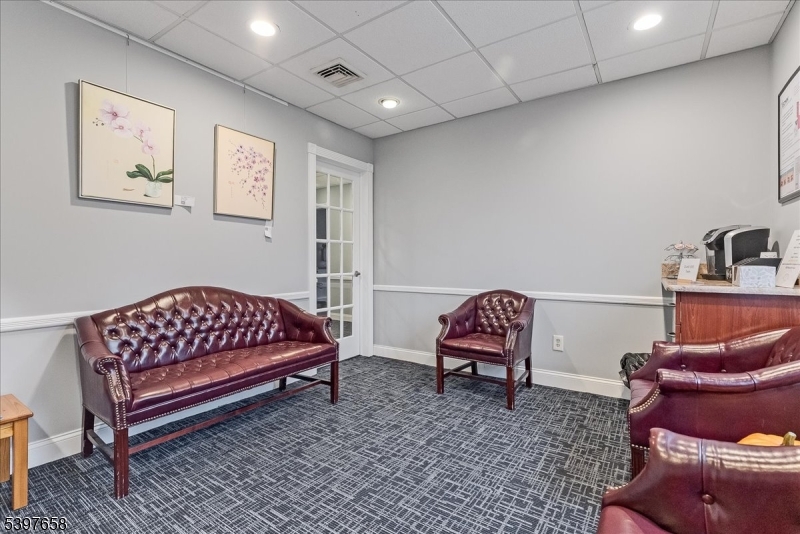 104 Ridgedale Avenue Cedar Knolls, NJ 07927 - Photo 17 of 47 a bedroom with a bed and chair