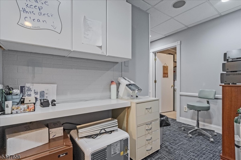 104 Ridgedale Avenue Cedar Knolls, NJ 07927 - Photo 28 of 47 a room with cabinets and wooden floor