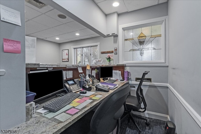 104 Ridgedale Avenue Cedar Knolls, NJ 07927 - Photo 30 of 47 a room with furniture a flat screen tv and a window