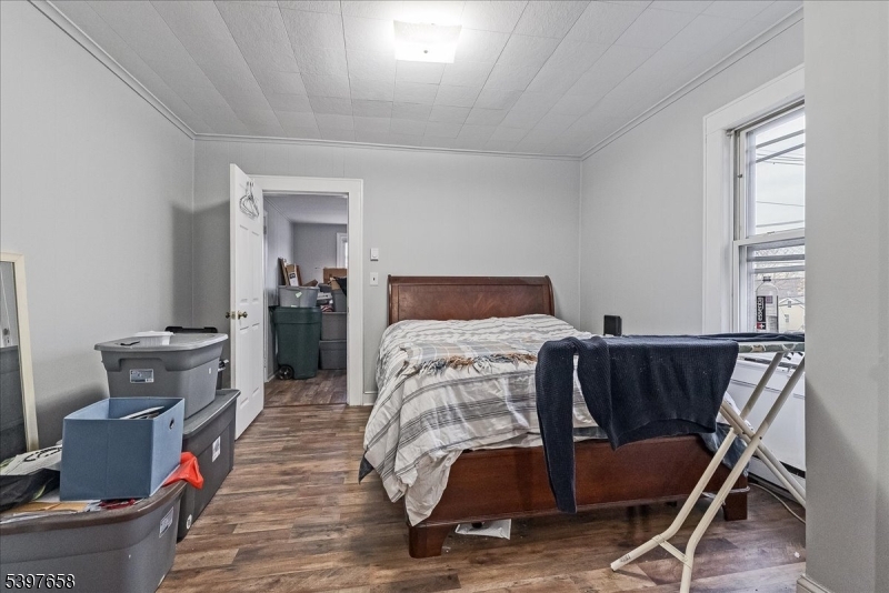 104 Ridgedale Avenue Cedar Knolls, NJ 07927 - Photo 38 of 47 a bedroom with furniture and wooden floor