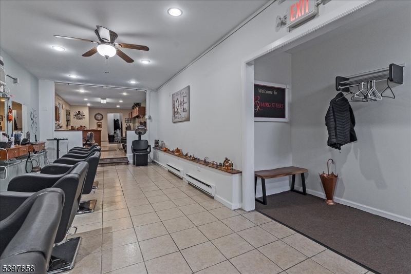 104 Ridgedale Avenue Cedar Knolls, NJ 07927 - Photo 4 of 47 a view of a hallway with workspace and couch