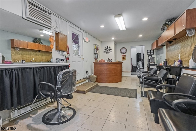 104 Ridgedale Avenue Cedar Knolls, NJ 07927 - Photo 6 of 47 a living room with furniture a rug and gym equipment