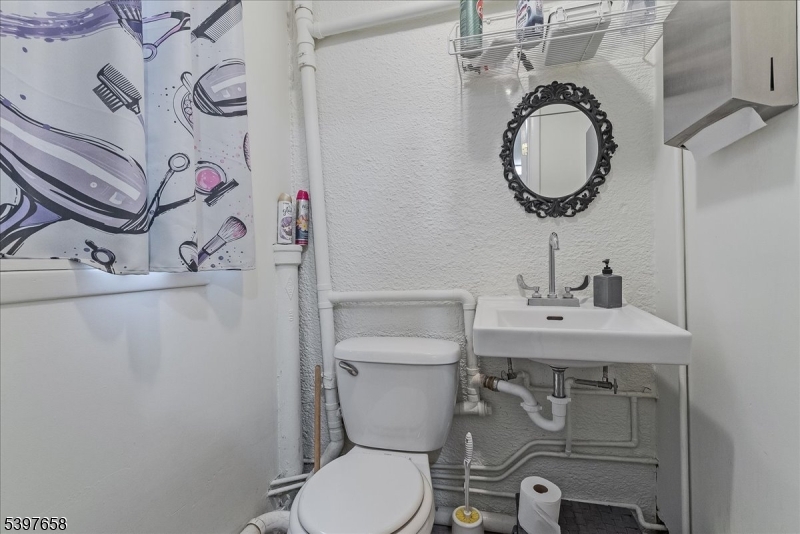 104 Ridgedale Avenue Cedar Knolls, NJ 07927 - Photo 10 of 47 a bathroom with a toilet sink and mirror
