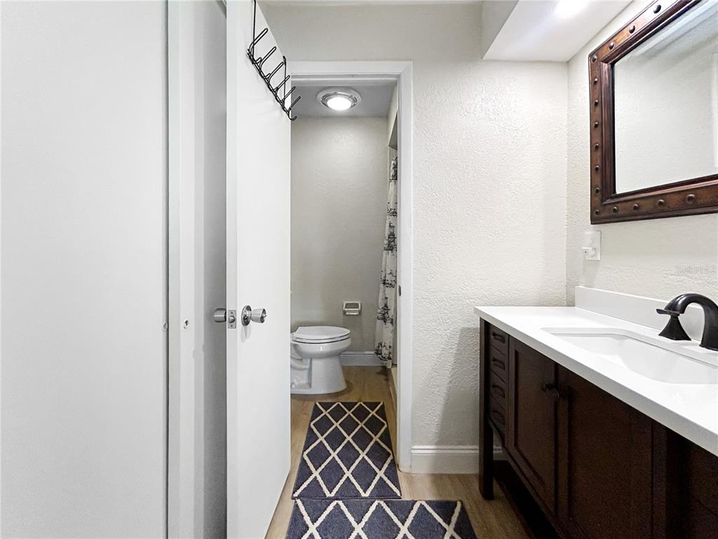 2505 Bay Boulevard, Unit 1 Indian Rocks Beach, FL 33785 - Photo 11 of 25 a bathroom with a sink and a mirror