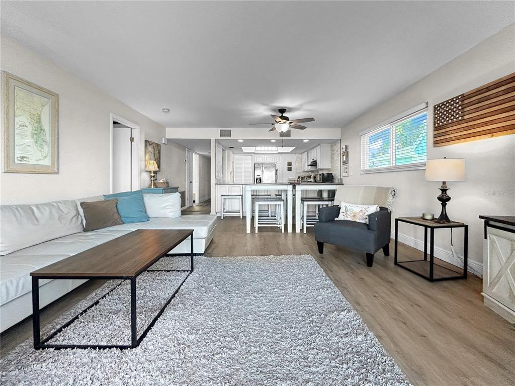 2505 Bay Boulevard, Unit 1 Indian Rocks Beach, FL 33785 - Photo 12 of 25 a living room with furniture and a dining table