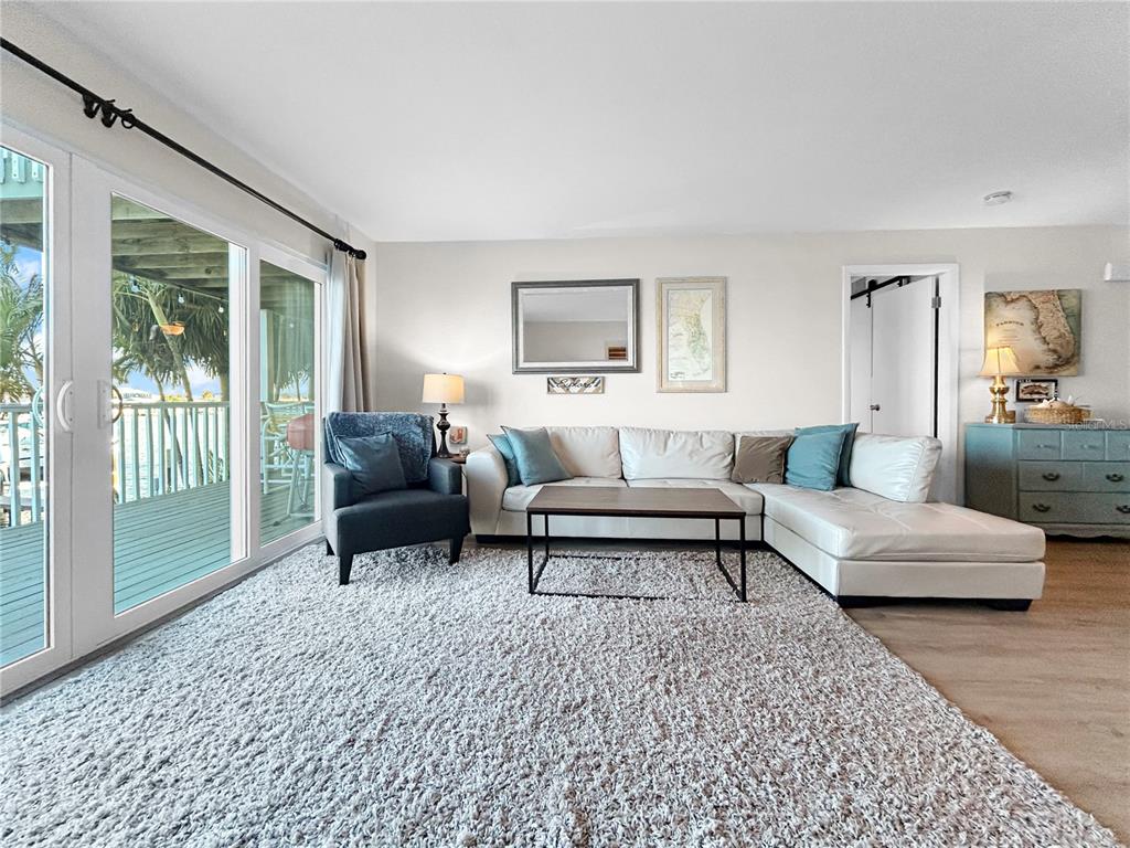 2505 Bay Boulevard, Unit 1 Indian Rocks Beach, FL 33785 - Photo 13 of 25 a living room with furniture and a rug