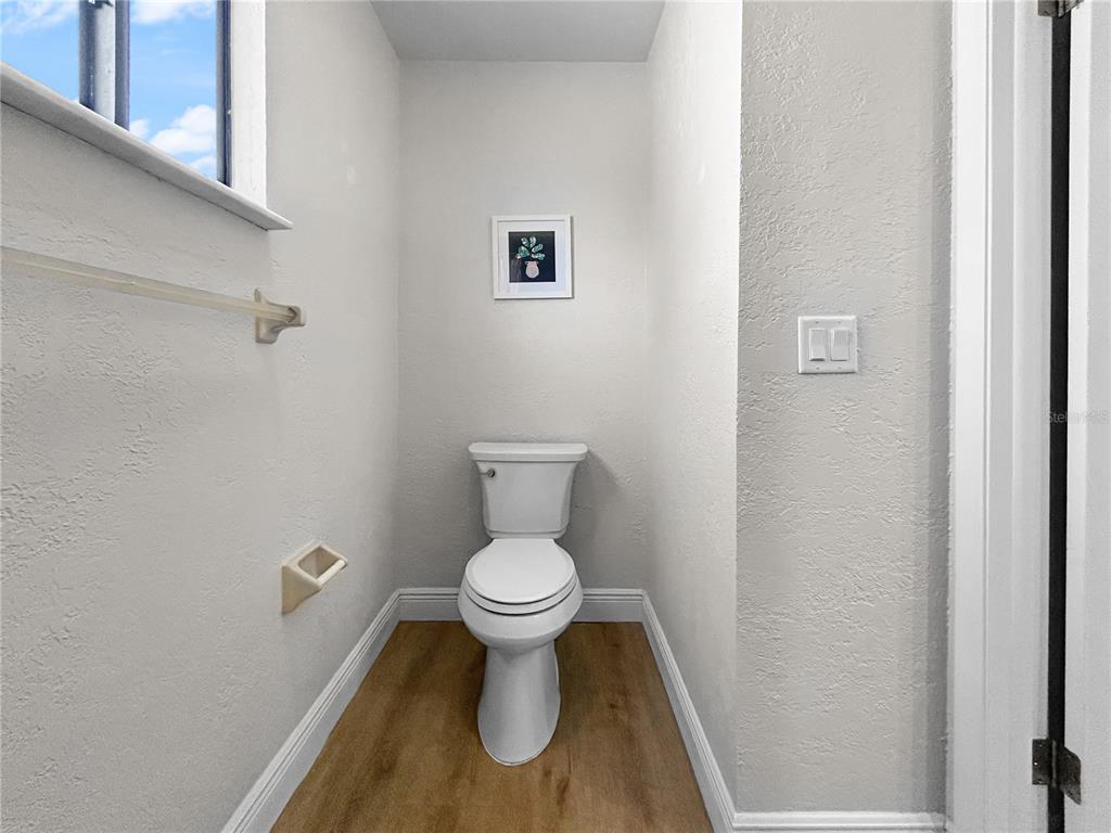 2505 Bay Boulevard, Unit 1 Indian Rocks Beach, FL 33785 - Photo 19 of 25 a bathroom with a toilet and a sink
