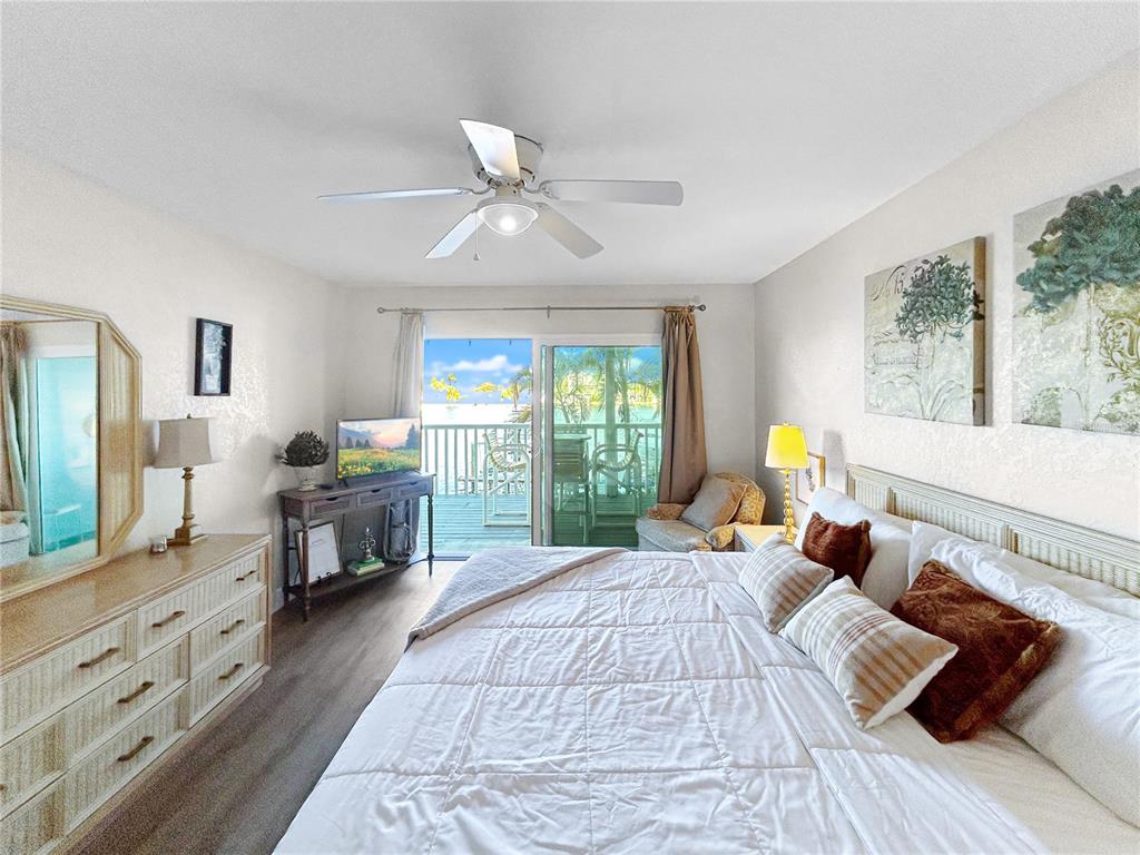 2505 Bay Boulevard, Unit 1 Indian Rocks Beach, FL 33785 - Photo 10 of 25 a bedroom with a bed and wooden floor