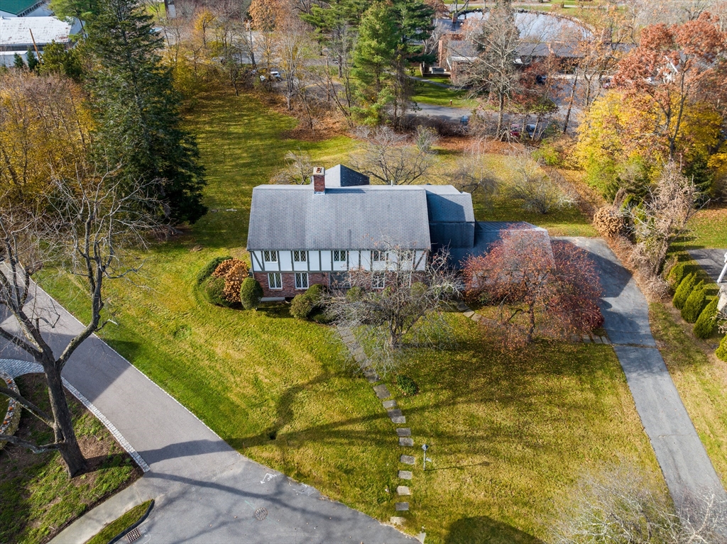 65 Temple Road Wellesley, MA 02482 - Photo 2 of 9 a aerial view of a house with swimming pool and large trees