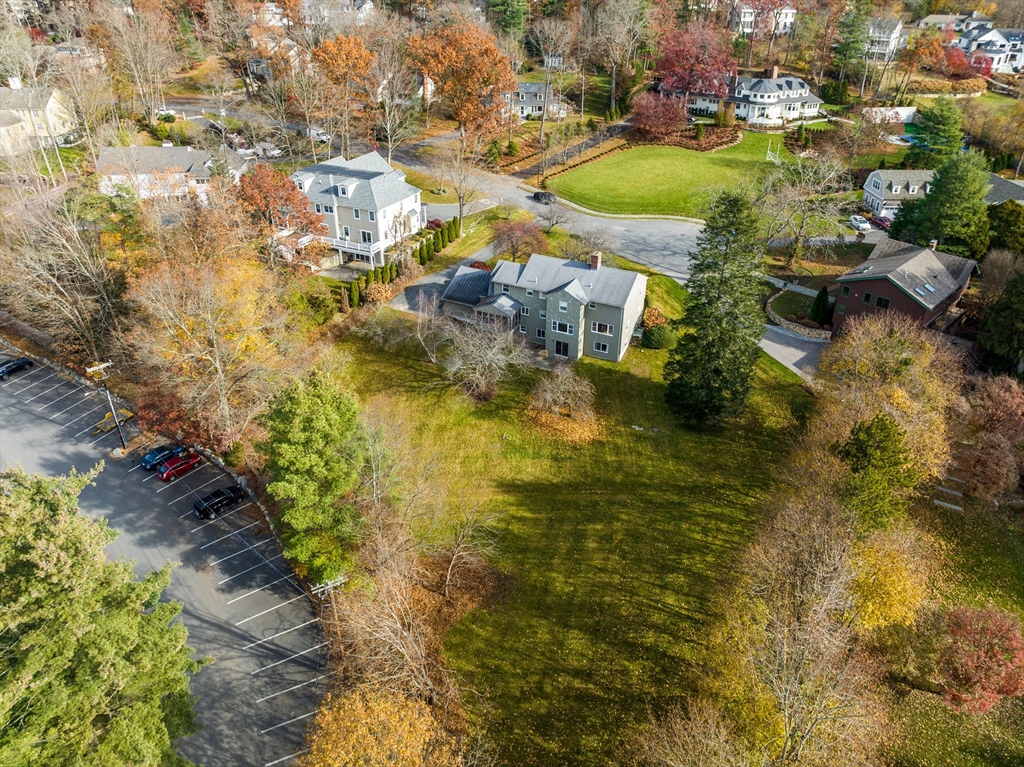 65 Temple Road Wellesley, MA 02482 - Photo 3 of 9 a view of a lake with a yard