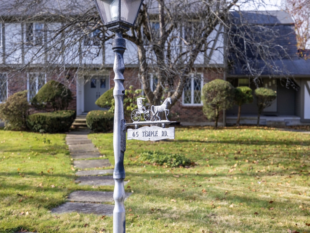 65 Temple Road Wellesley, MA 02482 - Photo 8 of 9 a backyard of a house with yard and outdoor seating
