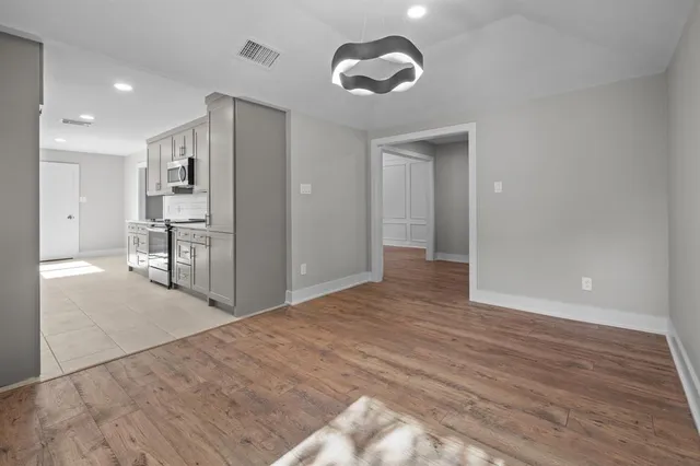 a view of a kitchen from the hallway