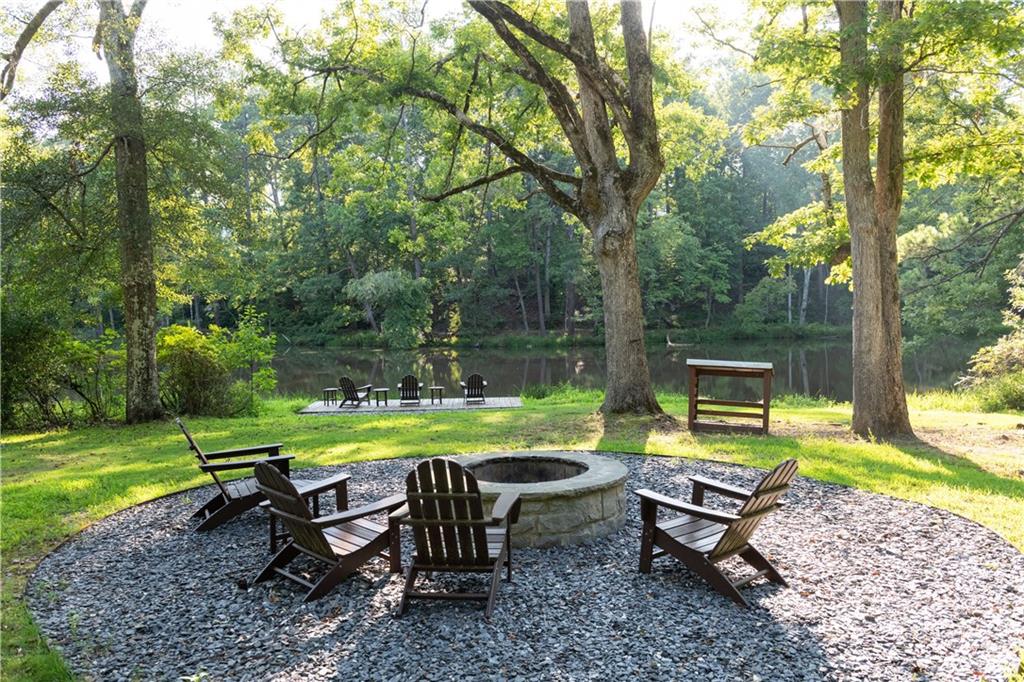 13585 Wood Fern Way Roswell, GA 30075 - Photo 5 of 12 a view of a park with furniture and garden