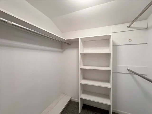 a view of an empty walk in closet