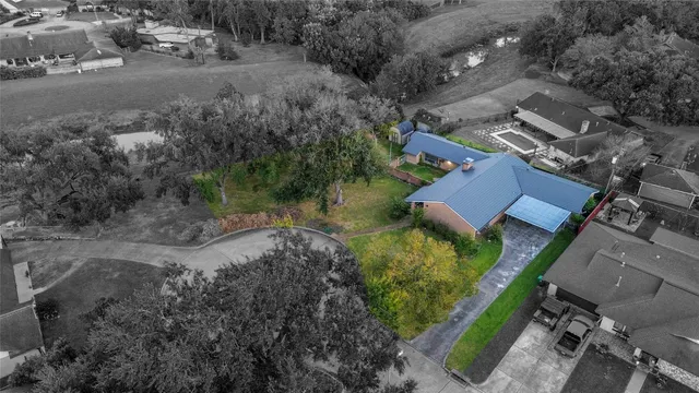 an aerial view of residential house with outdoor space