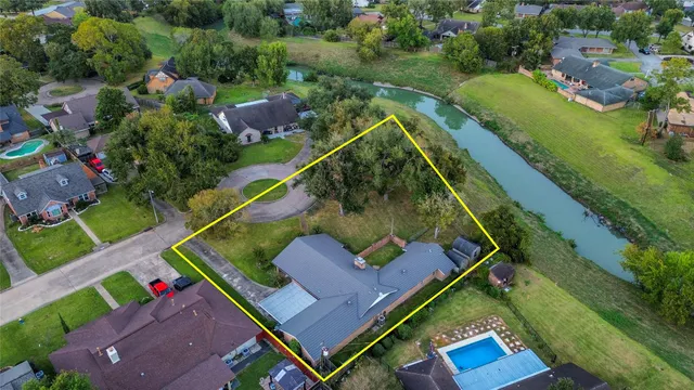 an aerial view of a house with a garden