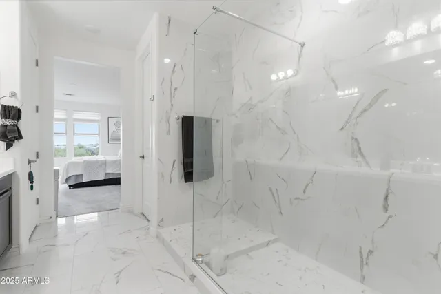 a spacious bathroom with a shower and a sink