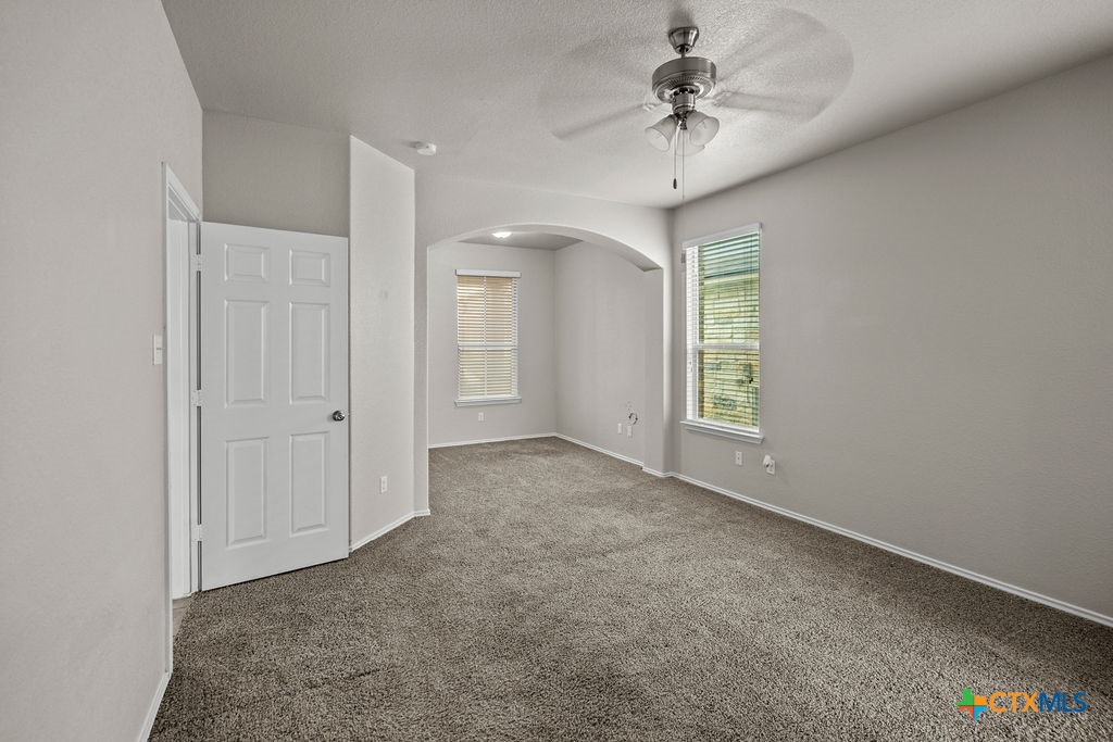 Undisclosed Address Temple, TX 76502 - Photo 13 of 36 an empty room with windows and fan