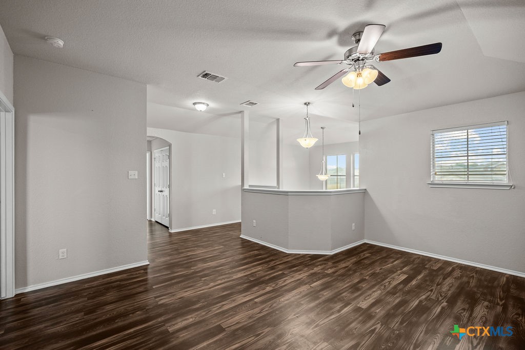 Undisclosed Address Temple, TX 76502 - Photo 23 of 36 a view of an empty room with wooden floor and fan