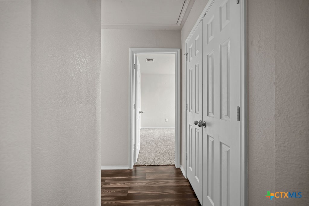 Undisclosed Address Temple, TX 76502 - Photo 26 of 36 a view of a hallway with wooden floor