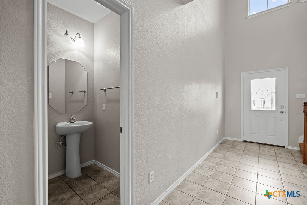 Undisclosed Address Temple, TX 76502 - Photo 4 of 36 a bathroom with a sink a toilet and mirror