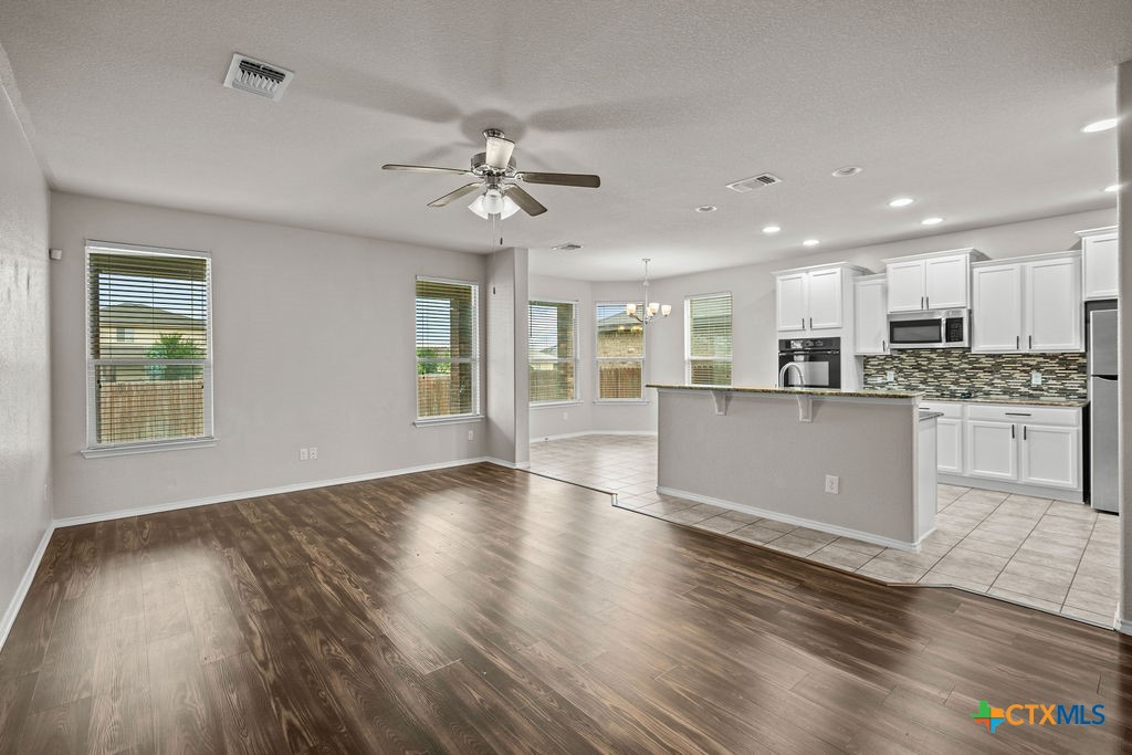 Undisclosed Address Temple, TX 76502 - Photo 6 of 36 a view of kitchen with cabinets and wooden floor