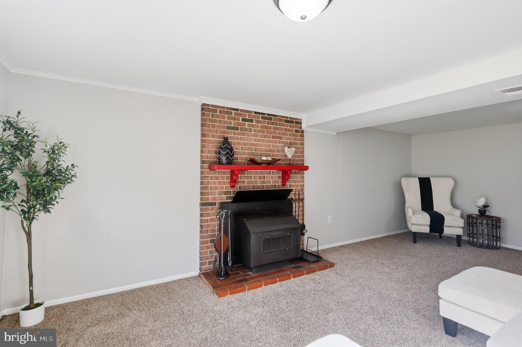 13528 Delaney Road Woodbridge, VA 22193 - Photo 23 of 39 Brick fireplace adds alternate heat source