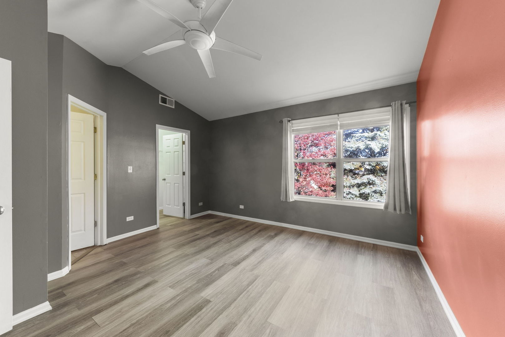 2911 Dearborn Court Naperville, IL 60563 - Photo 18 of 40 a view of an empty room with window and wooden floor