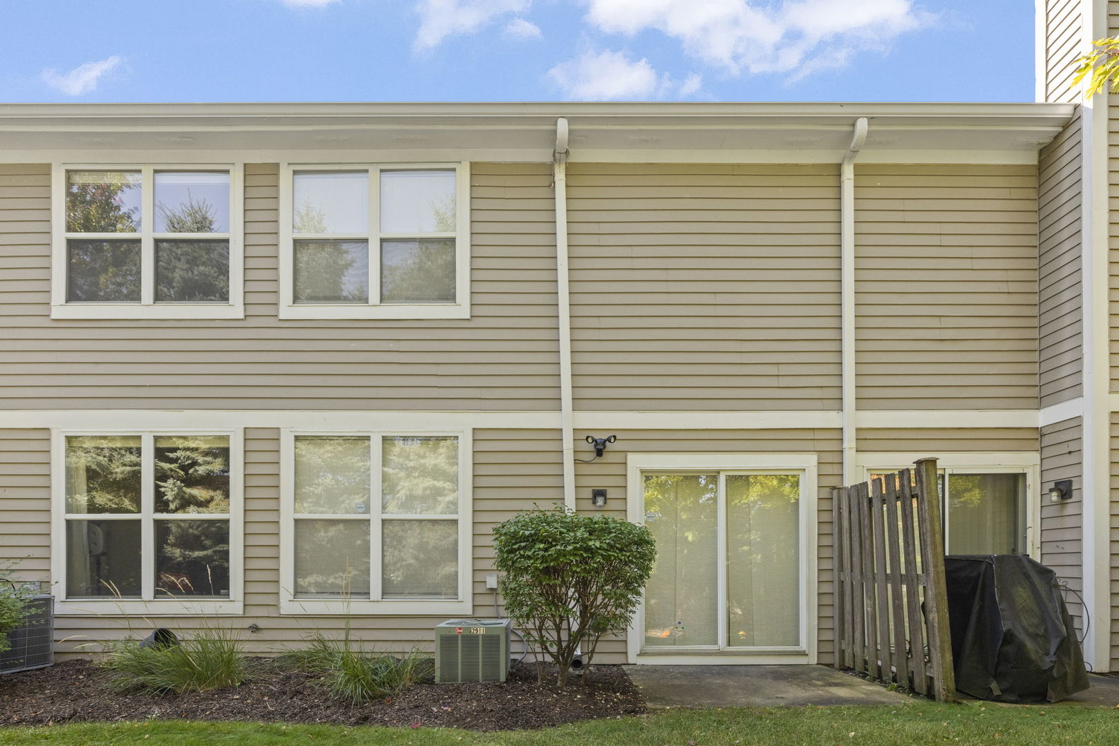 2911 Dearborn Court Naperville, IL 60563 - Photo 26 of 40 a view of a house with a yard and potted plants