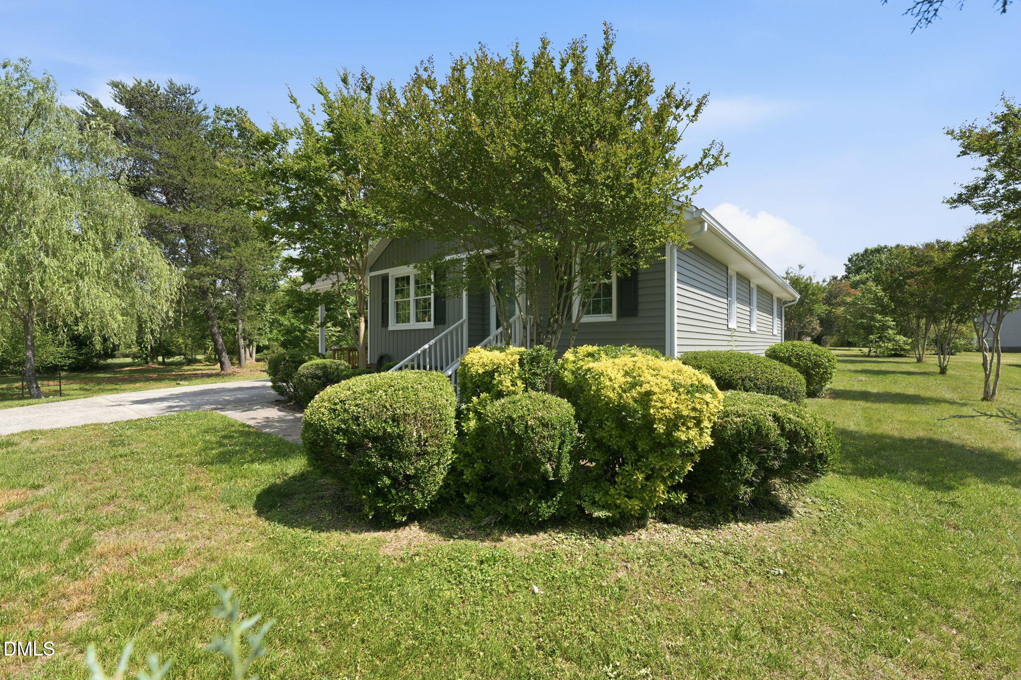 812 East Stagecoach Road Mebane, NC 27302 - Photo 2 of 25 a front view of a house with garden