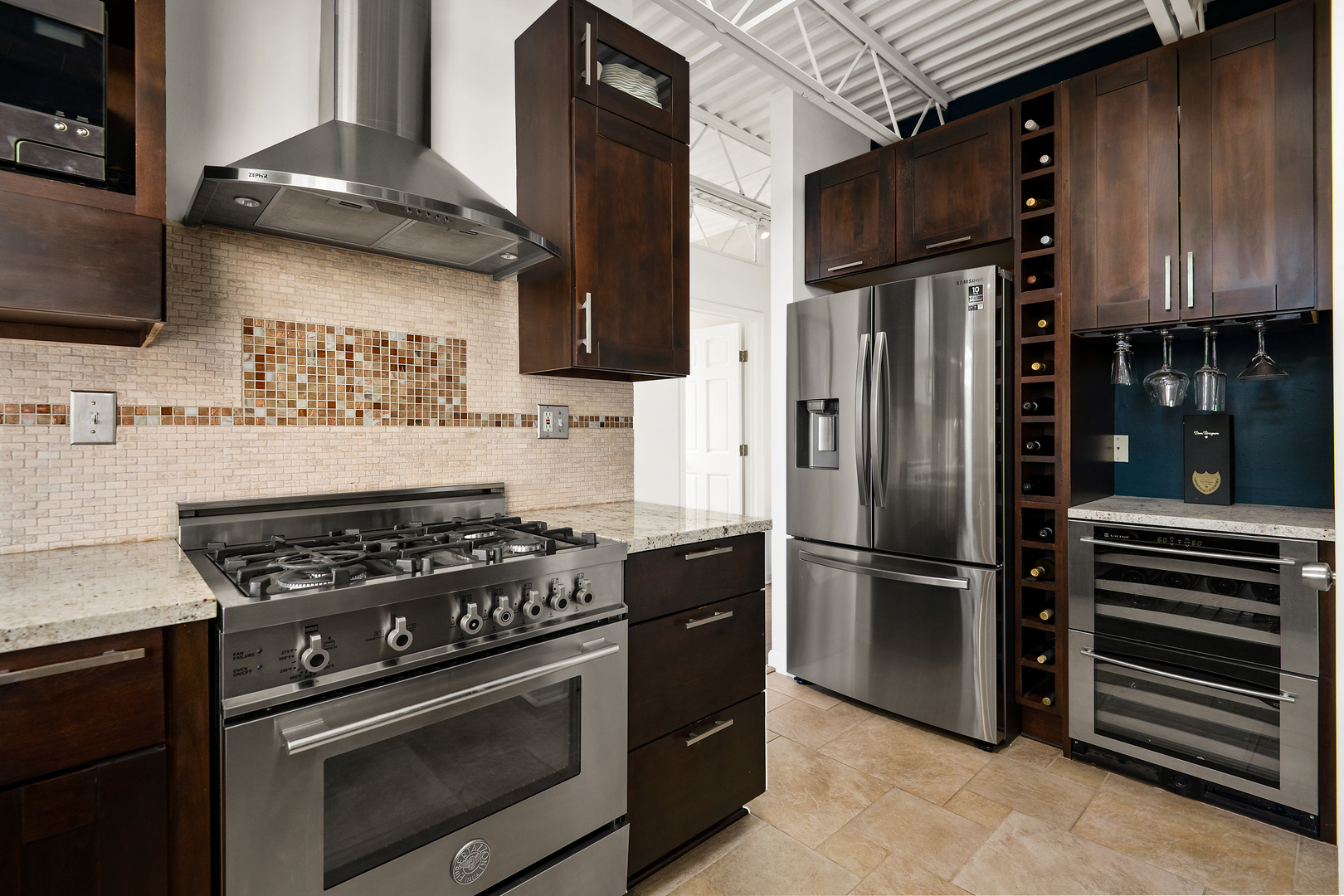 2101 West Rice Street, Unit 308 Chicago, IL 60622 - Photo 11 of 22 a kitchen with stainless steel appliances granite countertop a stove and a refrigerator