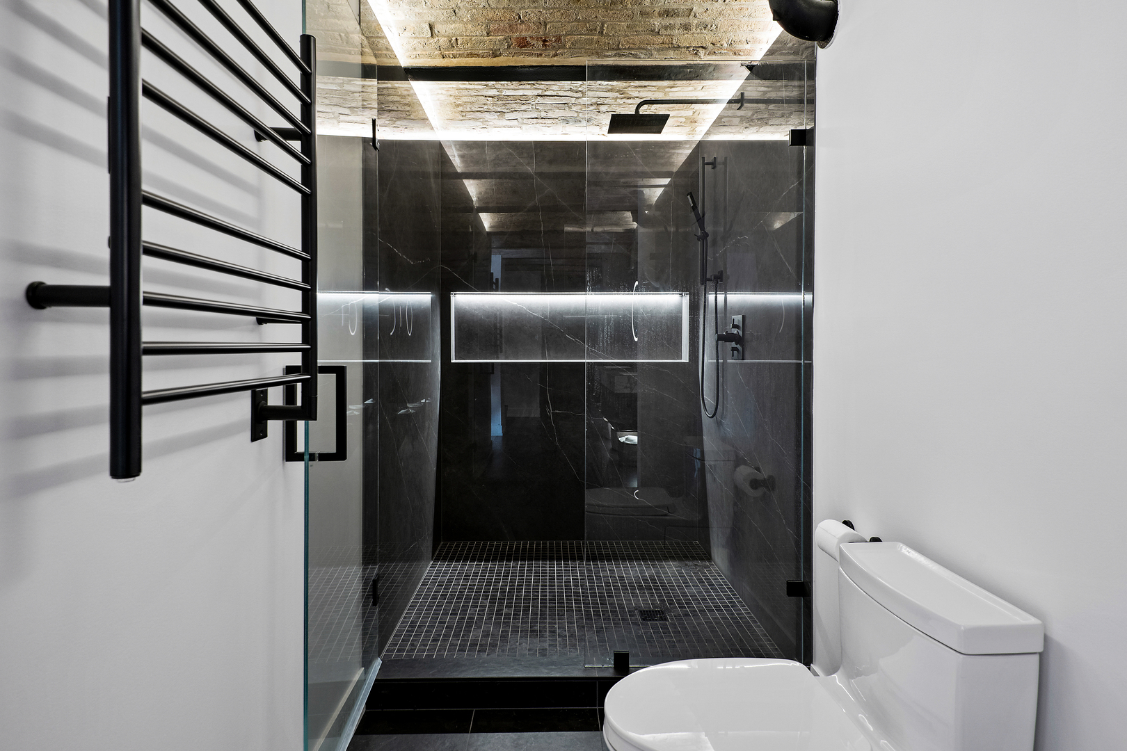 2101 West Rice Street, Unit 308 Chicago, IL 60622 - Photo 15 of 22 a bathroom with a toilet and a shower