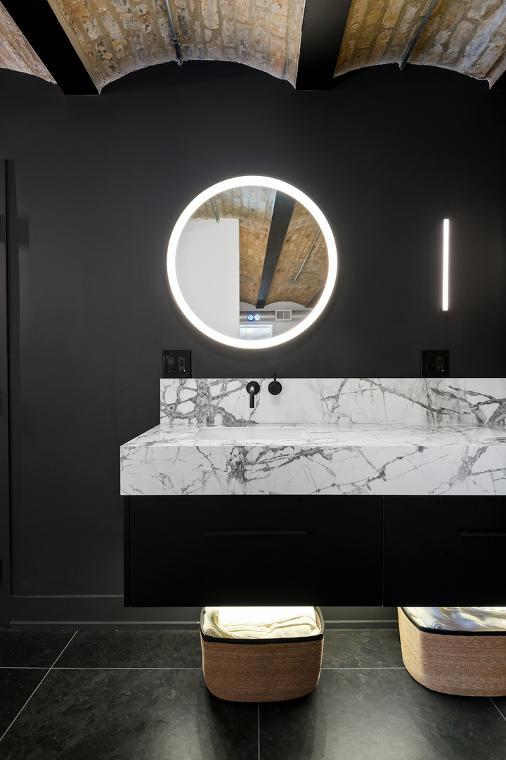 2101 West Rice Street, Unit 308 Chicago, IL 60622 - Photo 17 of 22 a bathroom with a sink and a mirror