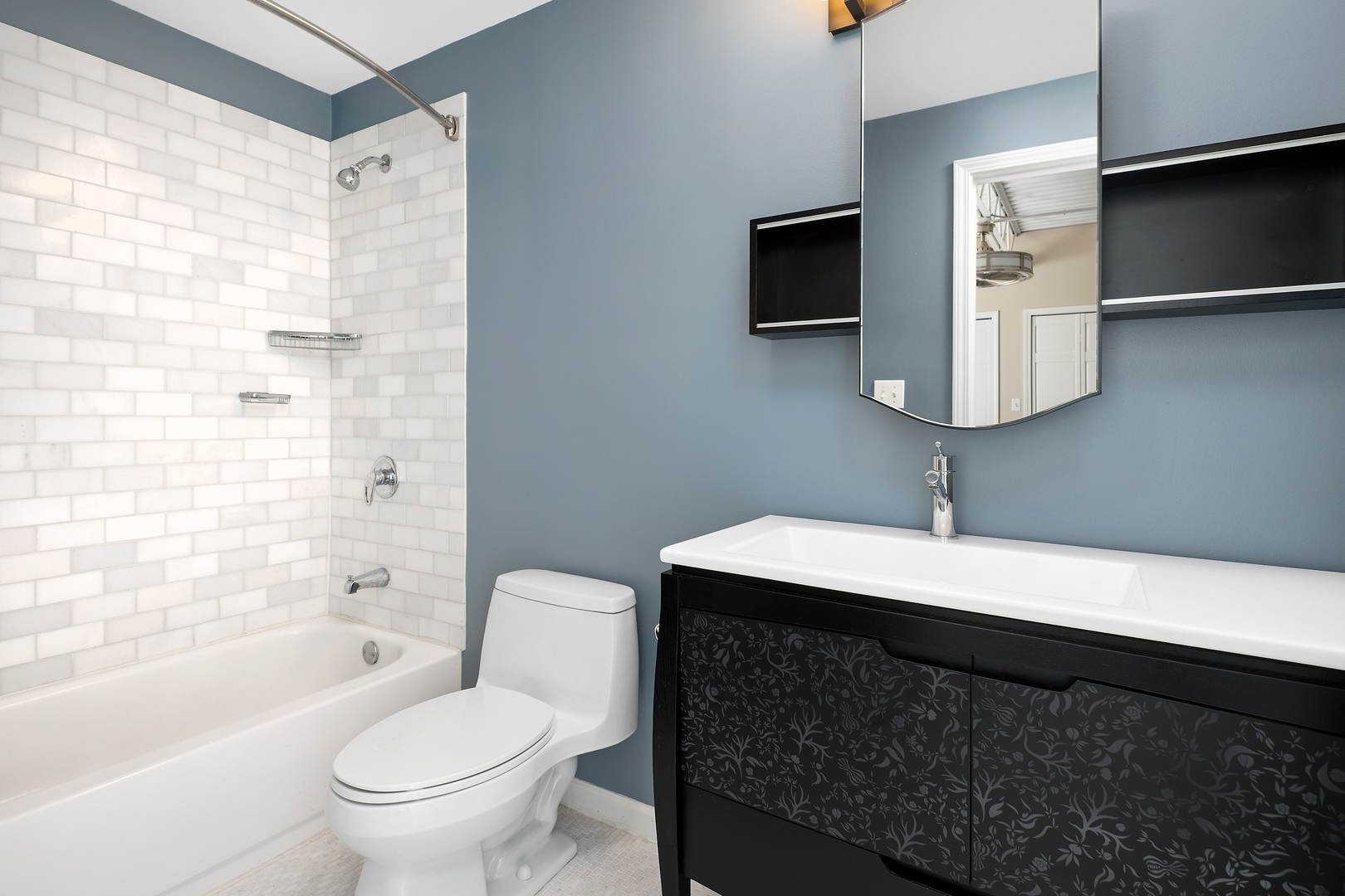 2101 West Rice Street, Unit 308 Chicago, IL 60622 - Photo 20 of 22 a bathroom with a sink toilet a mirror and bathtub