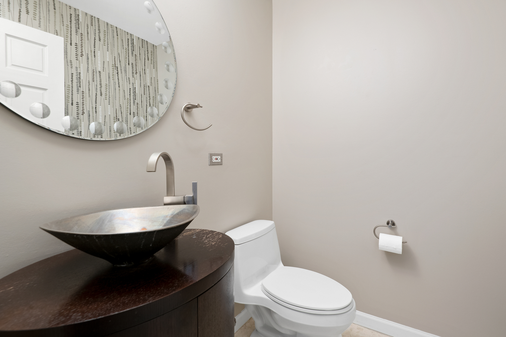 2101 West Rice Street, Unit 308 Chicago, IL 60622 - Photo 21 of 22 a bathroom with a toilet a sink and mirror