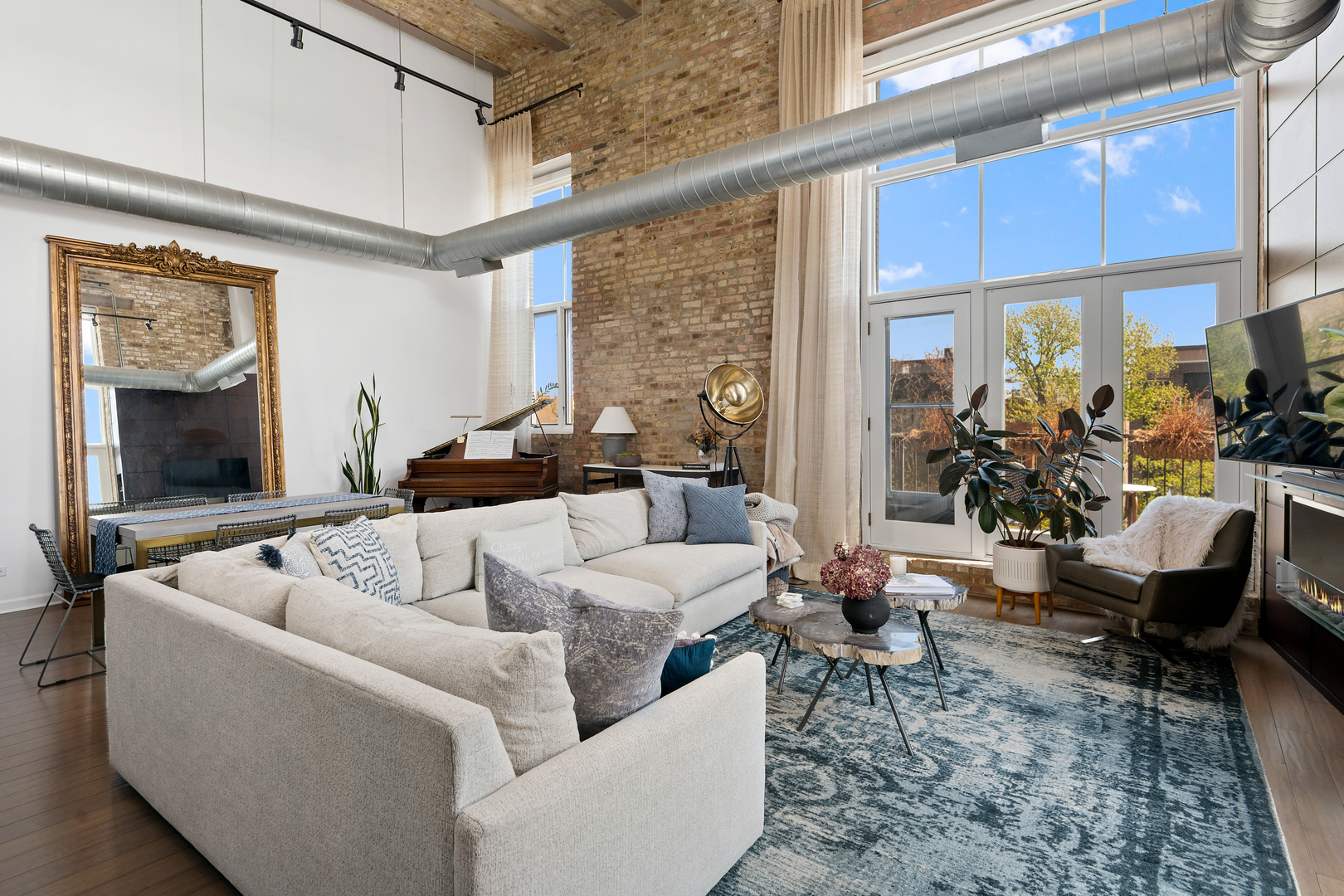 2101 West Rice Street, Unit 308 Chicago, IL 60622 - Photo 3 of 22 a living room with furniture and a large window