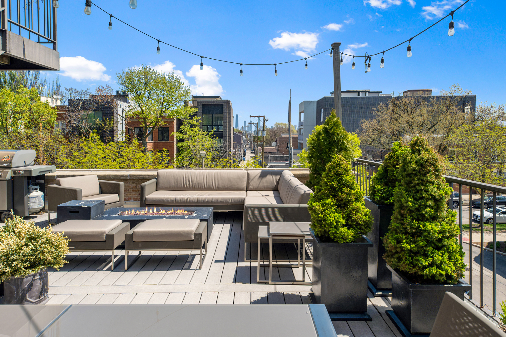 2101 West Rice Street, Unit 308 Chicago, IL 60622 - Photo 8 of 22 a view of a patio with couches table and chairs and potted plants